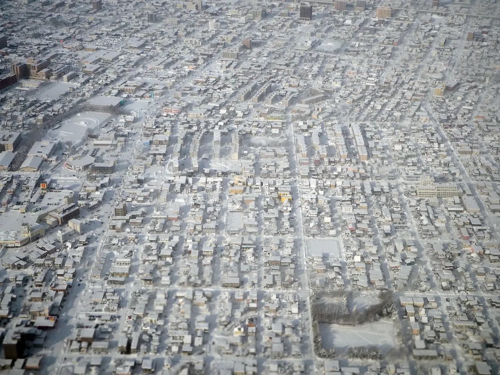 Asahikawa under snow, seen from the air. Inland Asahikawa is one of the colder places in Hokkaido.