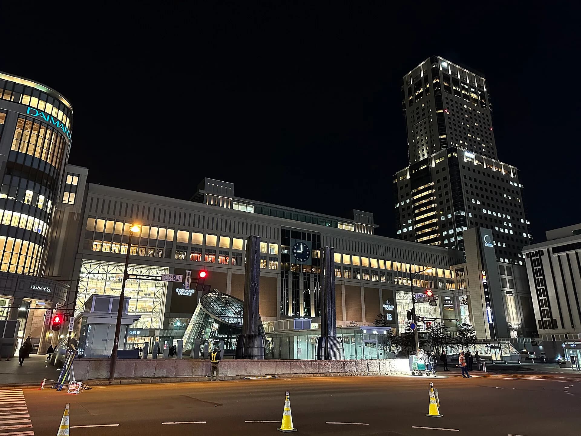 Sapporo Station’s south entrance at night. Consider meals and onward travel when choosing your hotel.