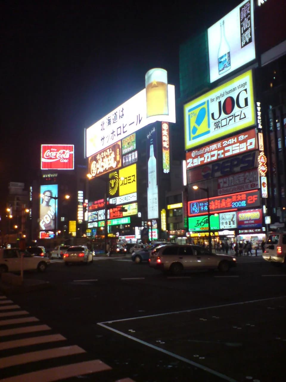 The illuminated signs and streets of Susukino at night.
