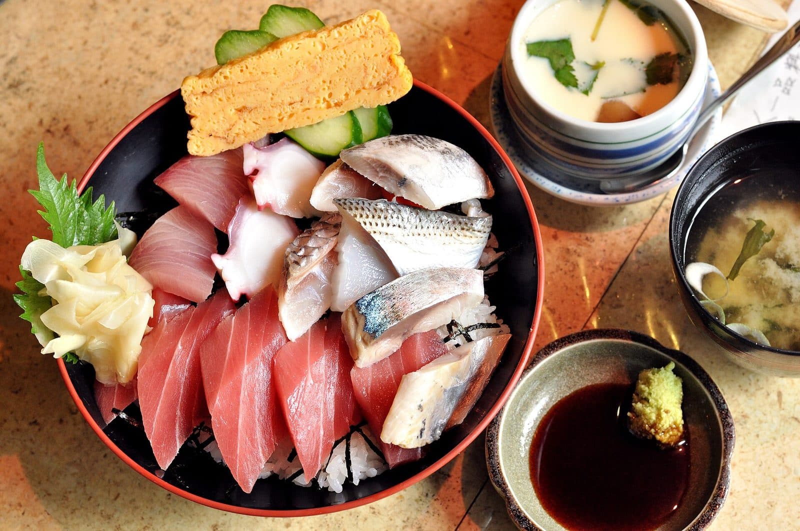 A seafood rice bowl. Toppings vary by restaurant and season.